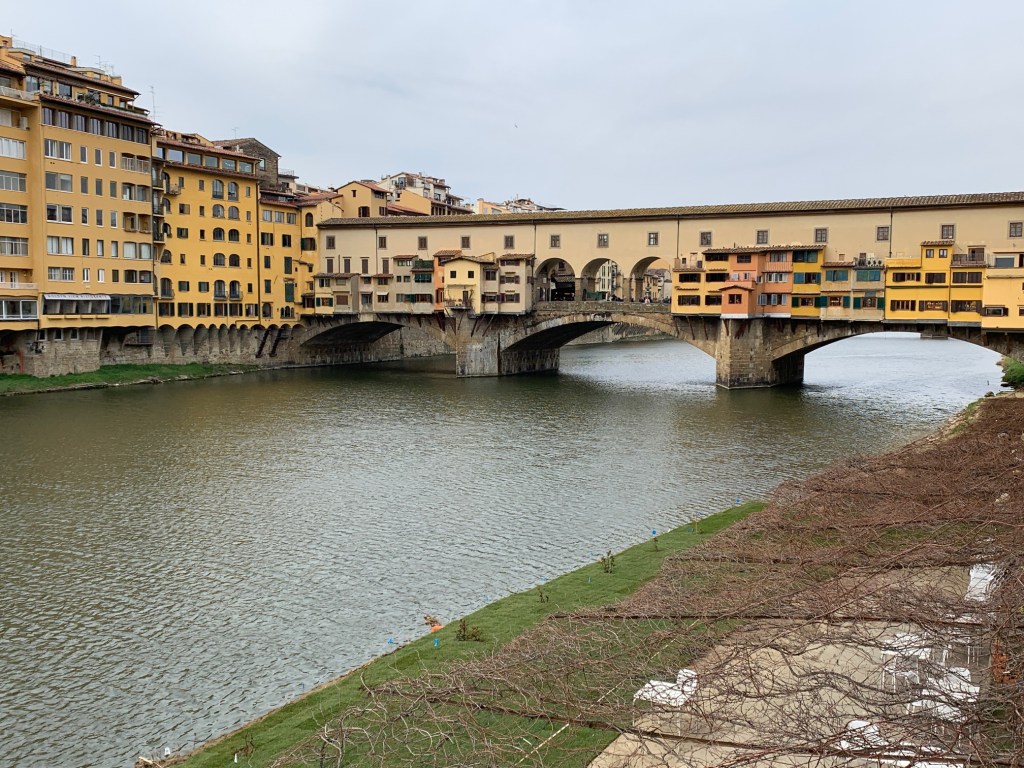 bridge over a river -Ponte Vecchio in Florence, Italy